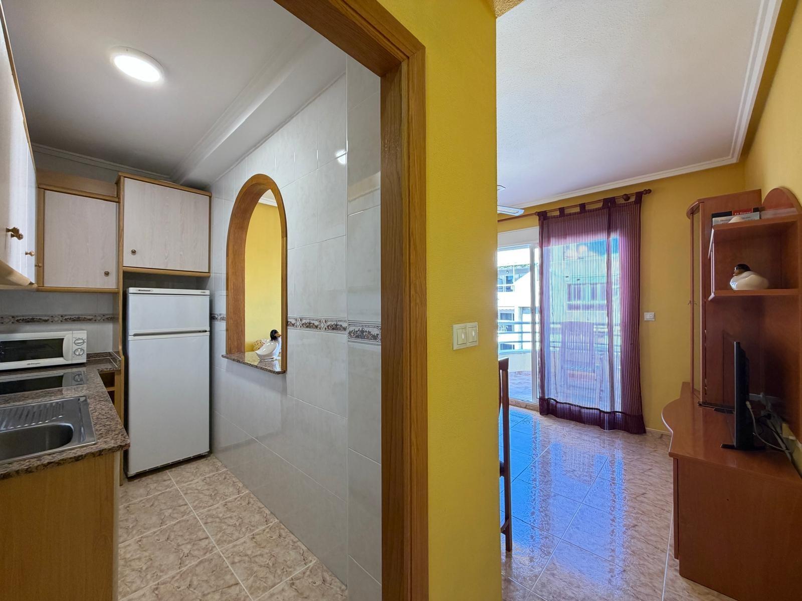 Terrace railing with street view below, 5th-floor penthouse Playa del Cura
