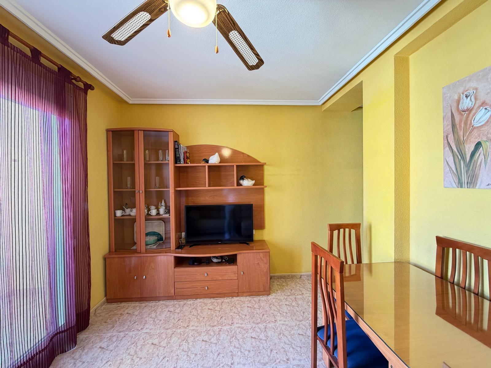 Living room with balcony door open, penthouse Playa del Cura