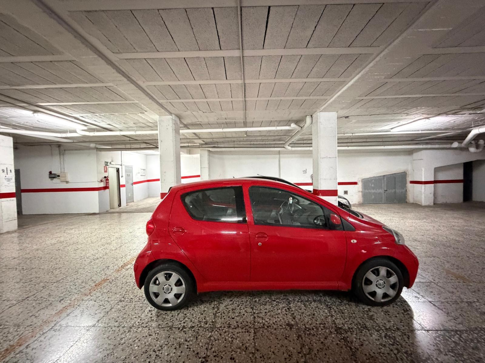 Garage floor with painted bay markings, penthouse Playa del Cura