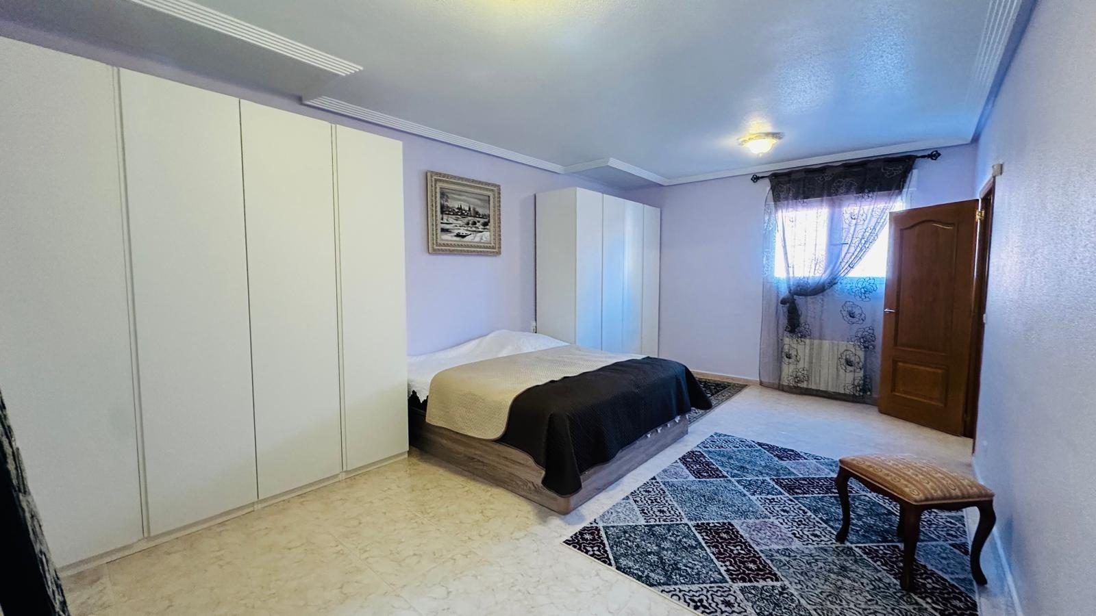 Pool terrace with garden surroundings at the Los Balcones villa in Torrevieja