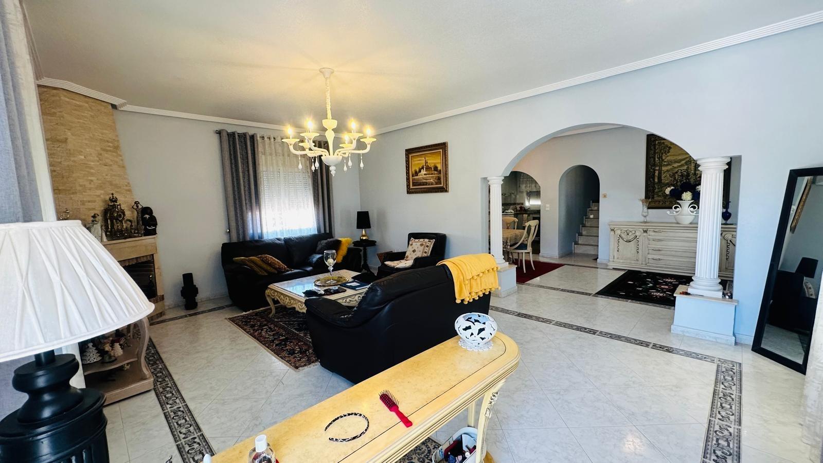 Living room with fireplace in a 3-bedroom villa in Los Balcones, Torrevieja