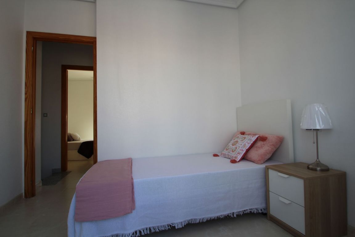 Street-facing facade of two-storey townhouse, Aguas Nuevas 1, Torrevieja