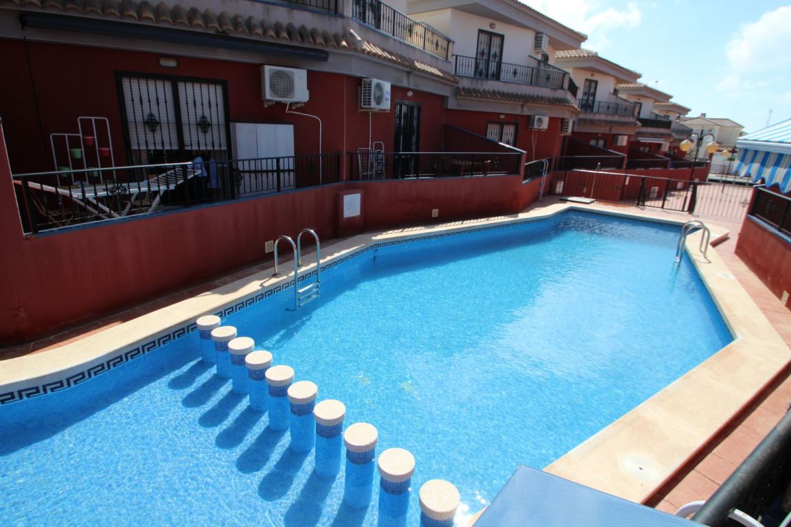 Balcony close-up showing facade and railing detail, townhouse Aguas Nuevas 1, Torrevieja