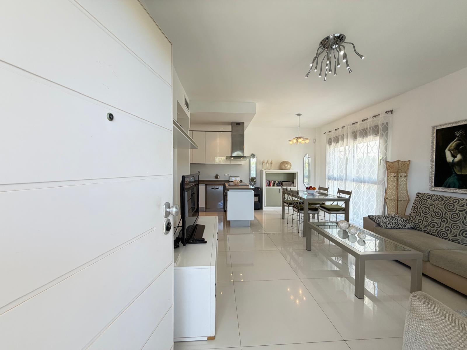 Dining area with natural light and tiled floor, villa in Doña Pepa