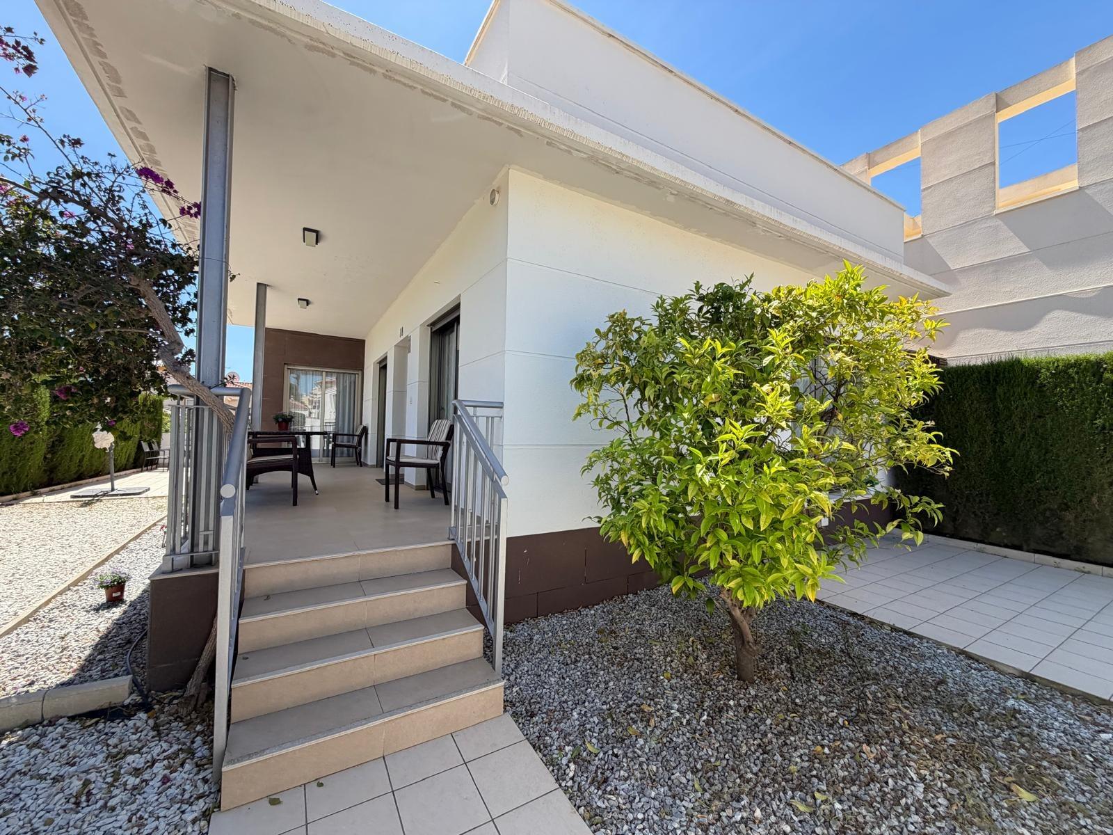 Open-plan dining and lounge area with natural light, villa in Doña Pepa