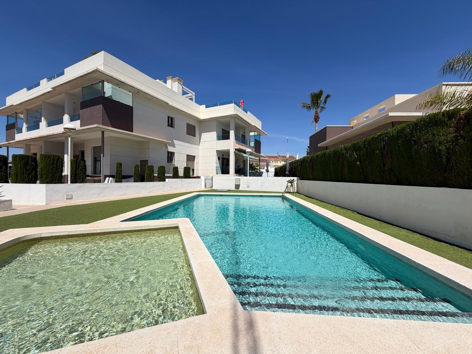 Communal pool area with surrounding wall, Doña Pepa