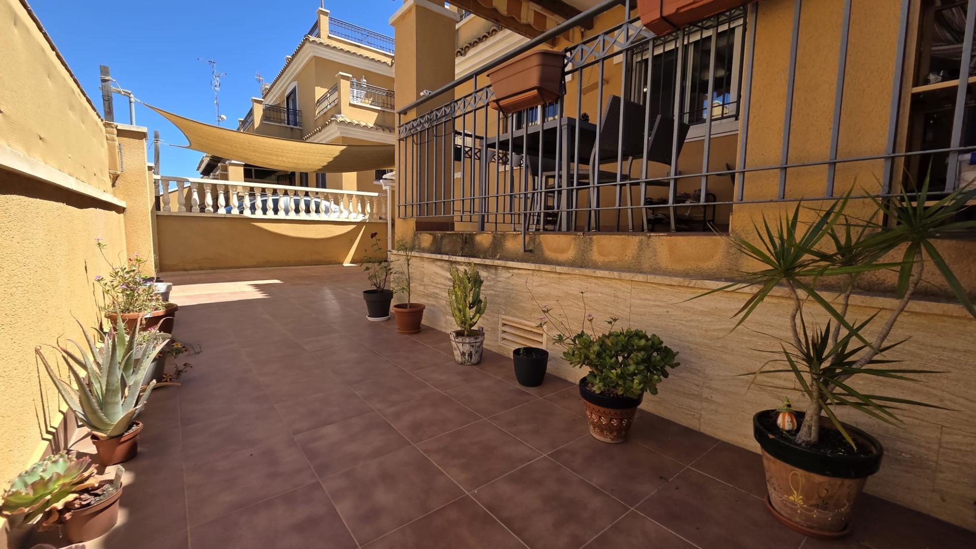 Open-plan living and dining room with terrace access, townhouse in Aguas Nuevas