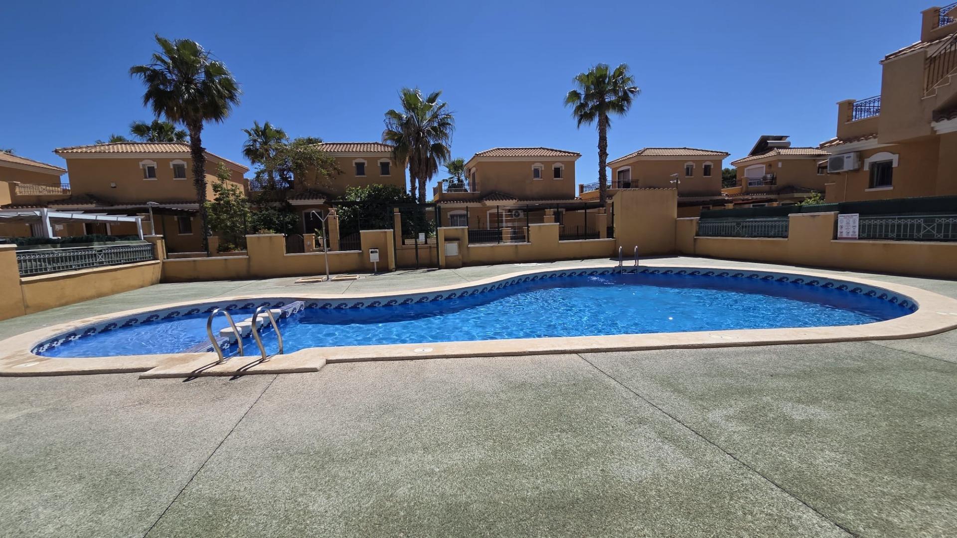 Communal pool with seating area, gated urbanisation Aguas Nuevas, Torrevieja