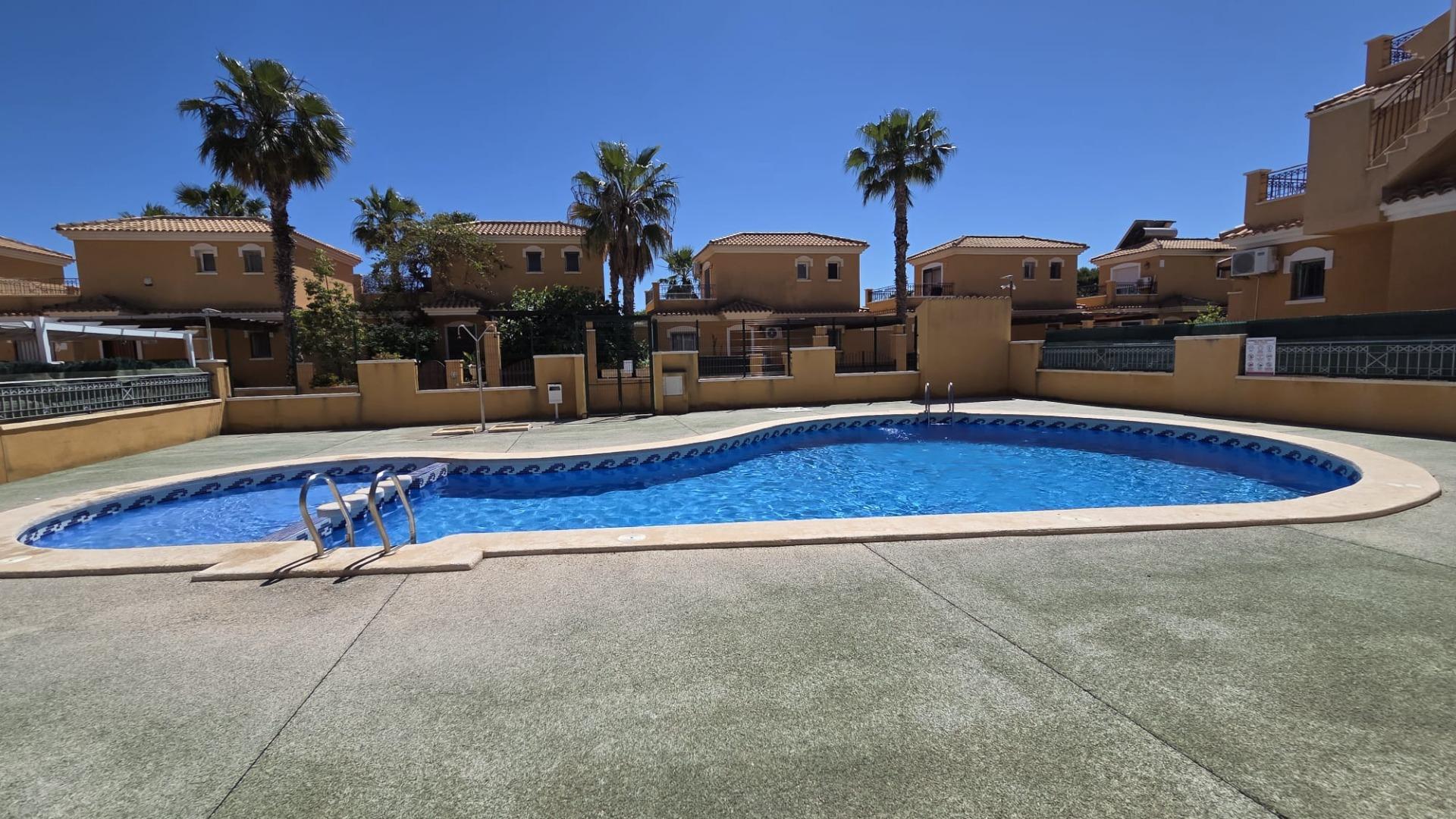 Exterior wide view of corner townhouse plot, Aguas Nuevas, Torrevieja