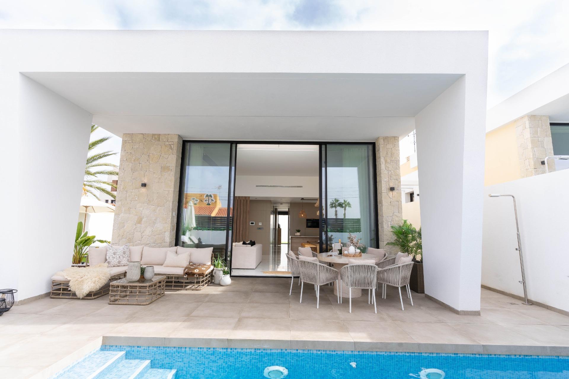 Entrance hallway with panel wall detailing, new-build villa in La Siesta
