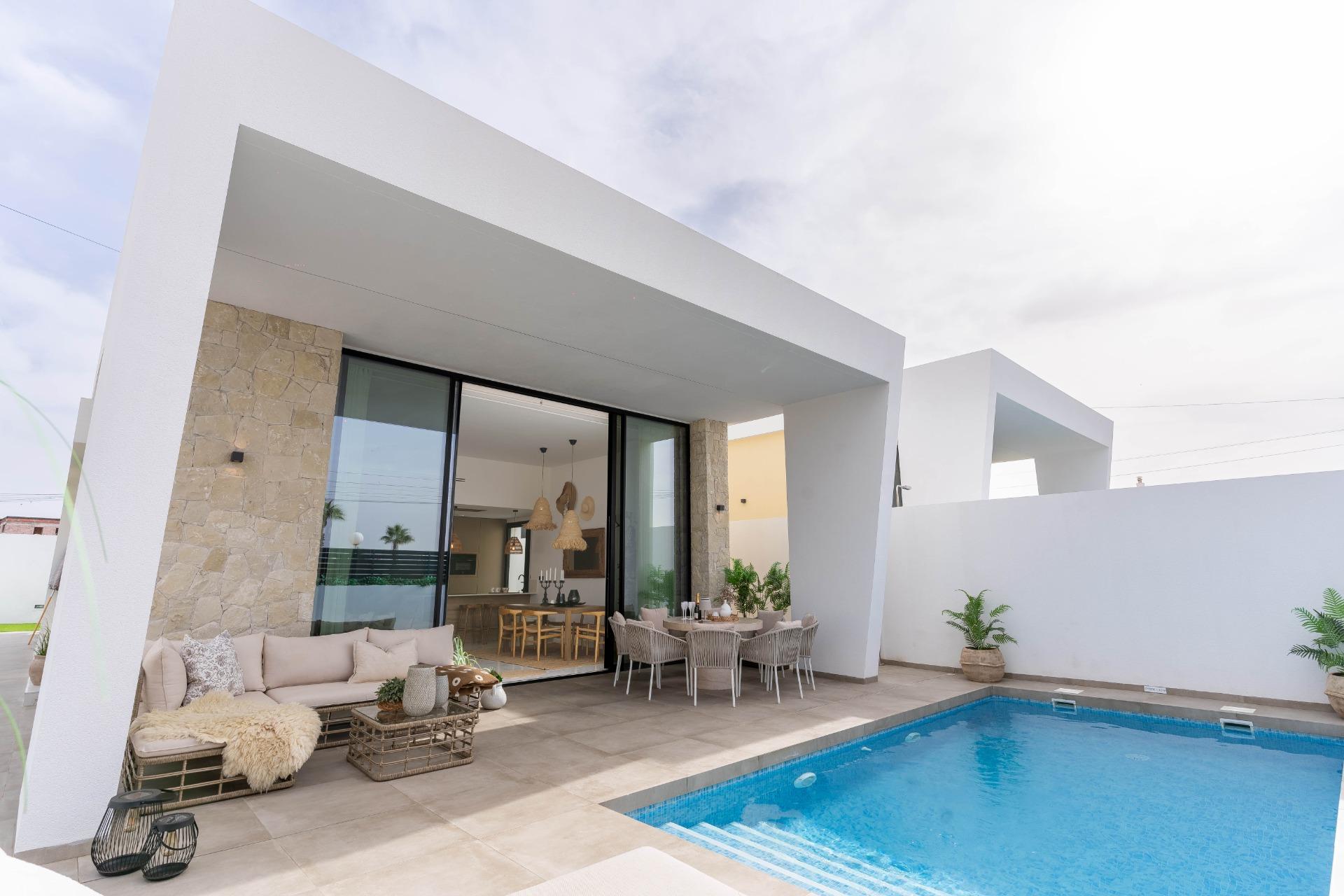 Front garden and two-car parking area at street frontage, La Siesta villa