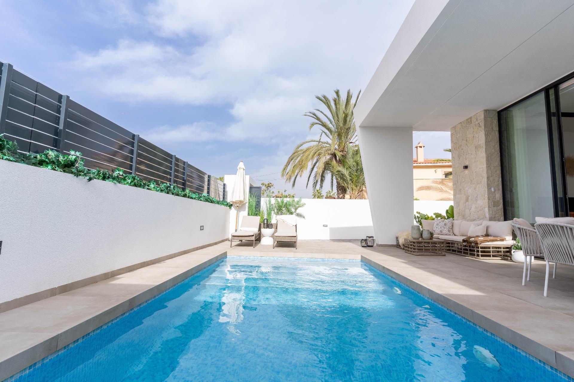 Pool terrace with sunbathing area alongside pool, La Siesta villa