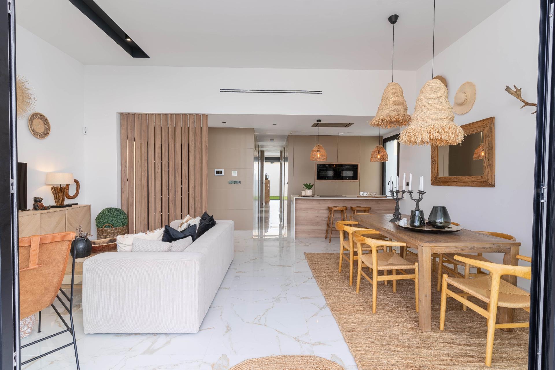 Lounge seating area with garden outlook through glazing, La Siesta villa