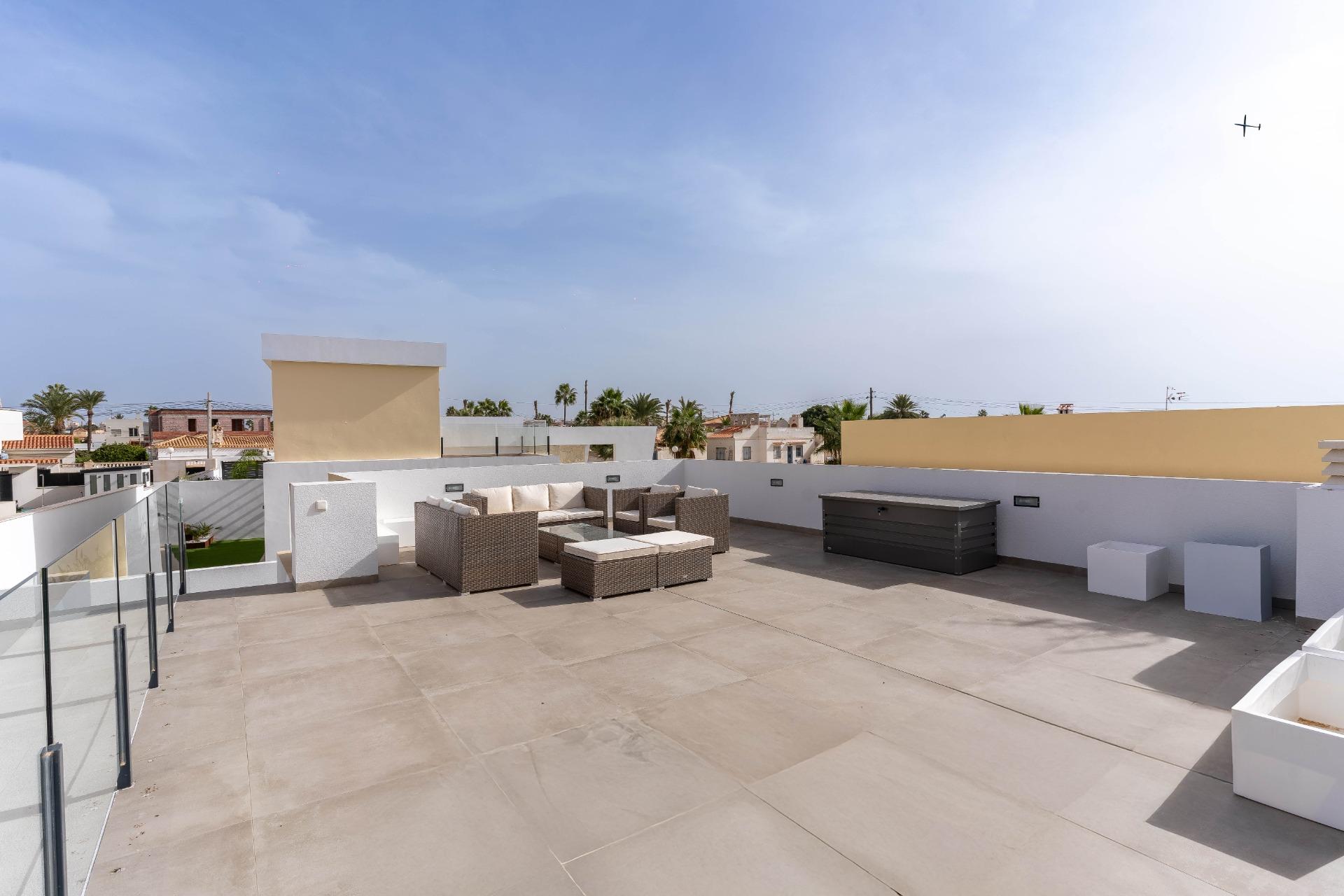 Exterior side elevation showing render and window frames, La Siesta villa