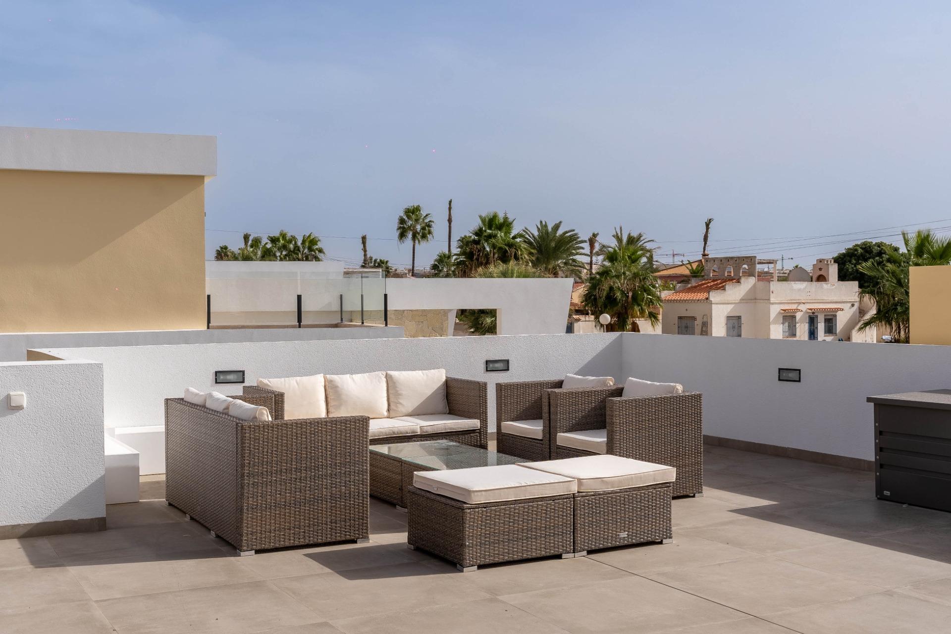 Terrace lounge with chill-out seating and pool backdrop, La Siesta villa