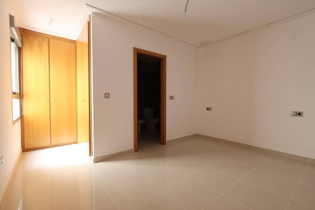 Living and dining room with tiled floor in 3-bedroom apartment, La Mata Pueblo, Torrevieja
