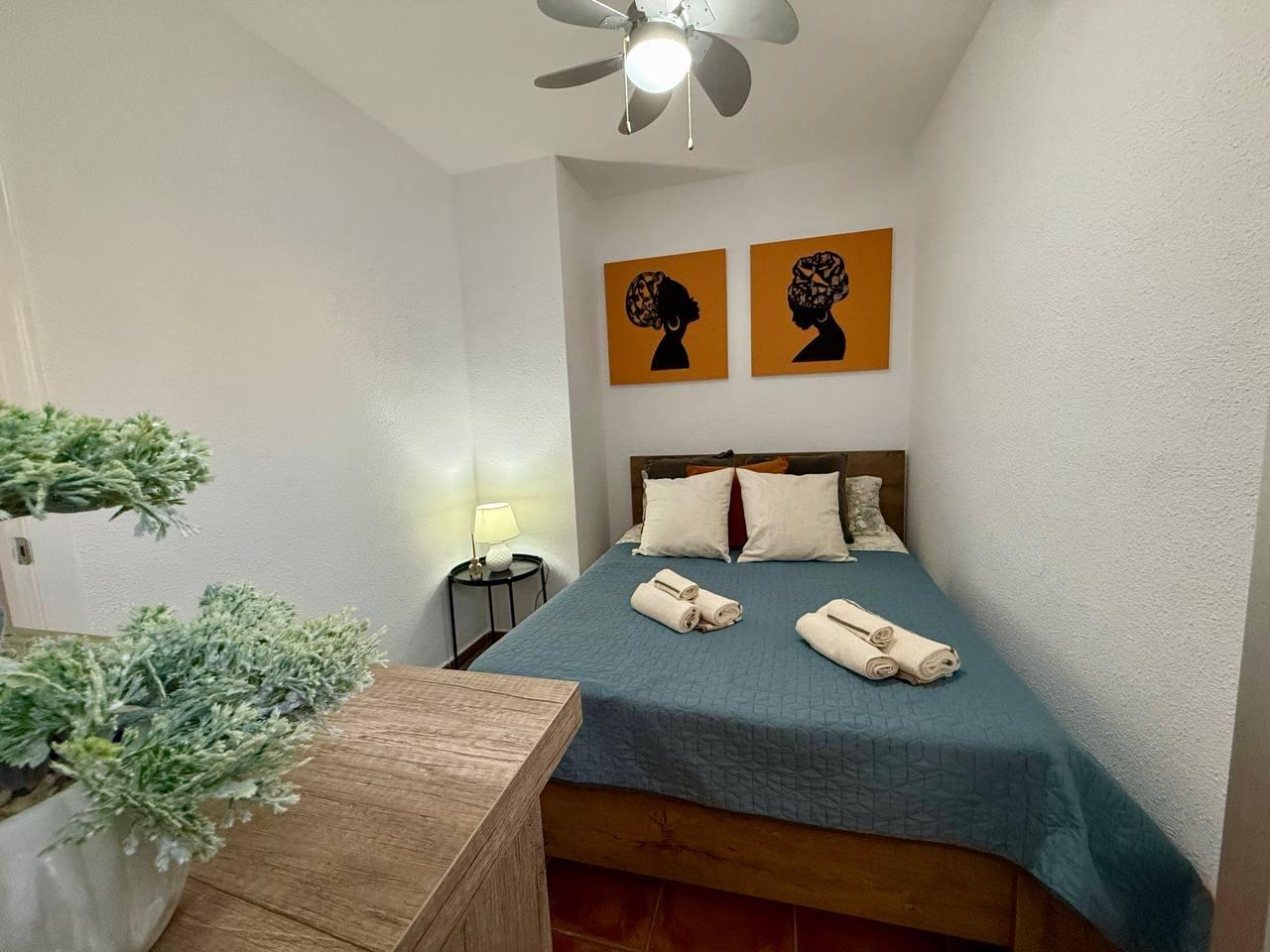Main bedroom with curtains and fitted wardrobe, Playa del Cura apartment