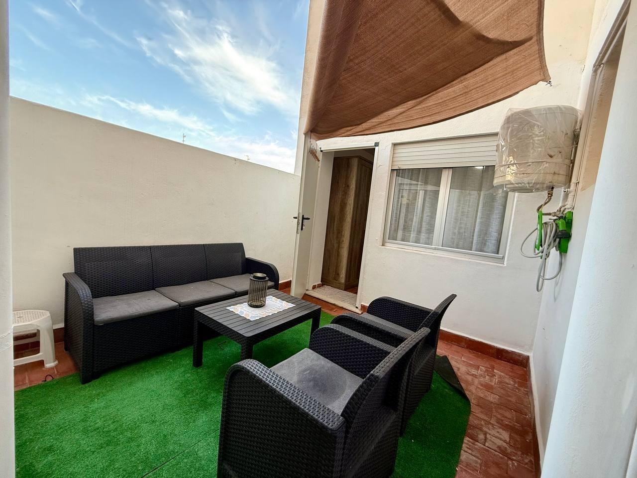 Balcony floor tiles and rendered exterior wall, Playa del Cura apartment
