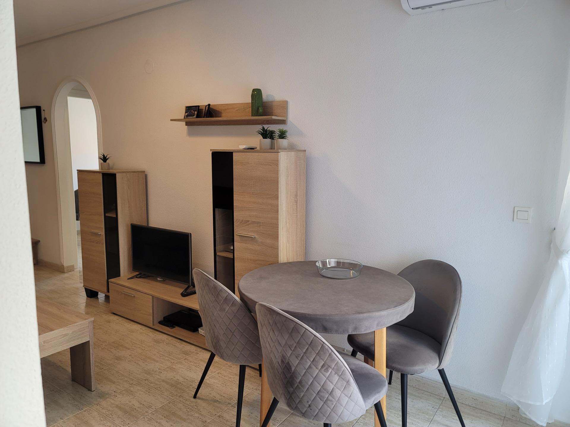 Living area with air conditioning unit in 2-bedroom penthouse, Acequion, Torrevieja