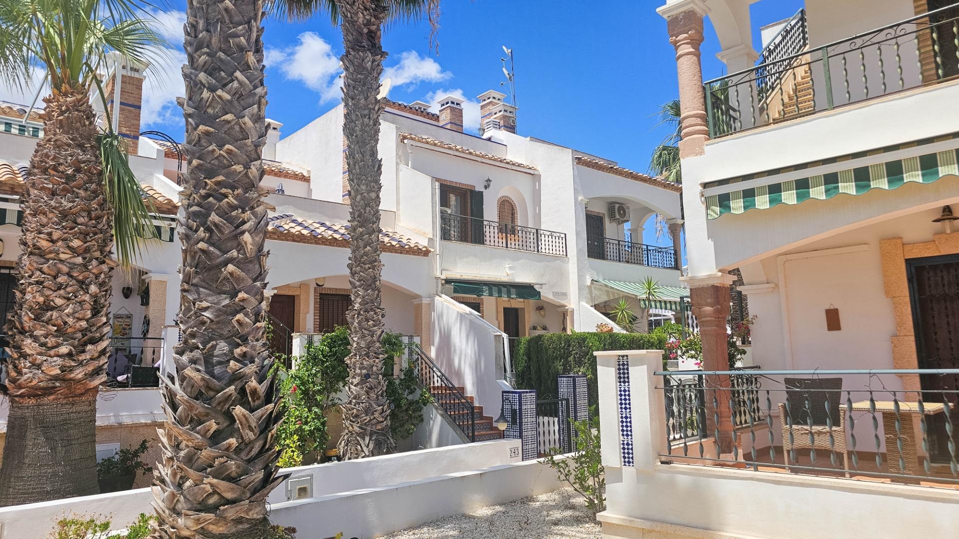 Living room with fireplace and open-plan layout in 1-bedroom townhouse, PAU 8, Orihuela Costa