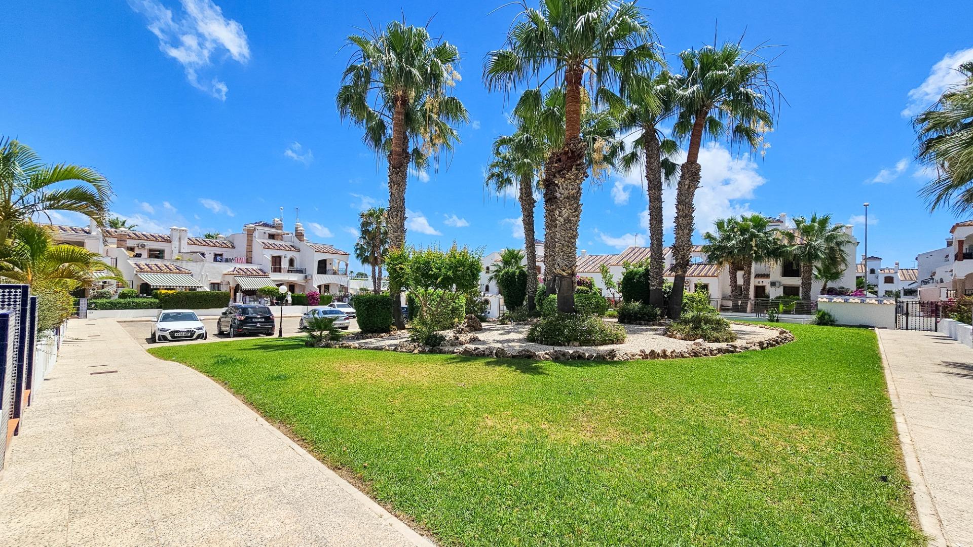 Communal garden and pool area in gated urbanisation, PAU 8, Orihuela Costa