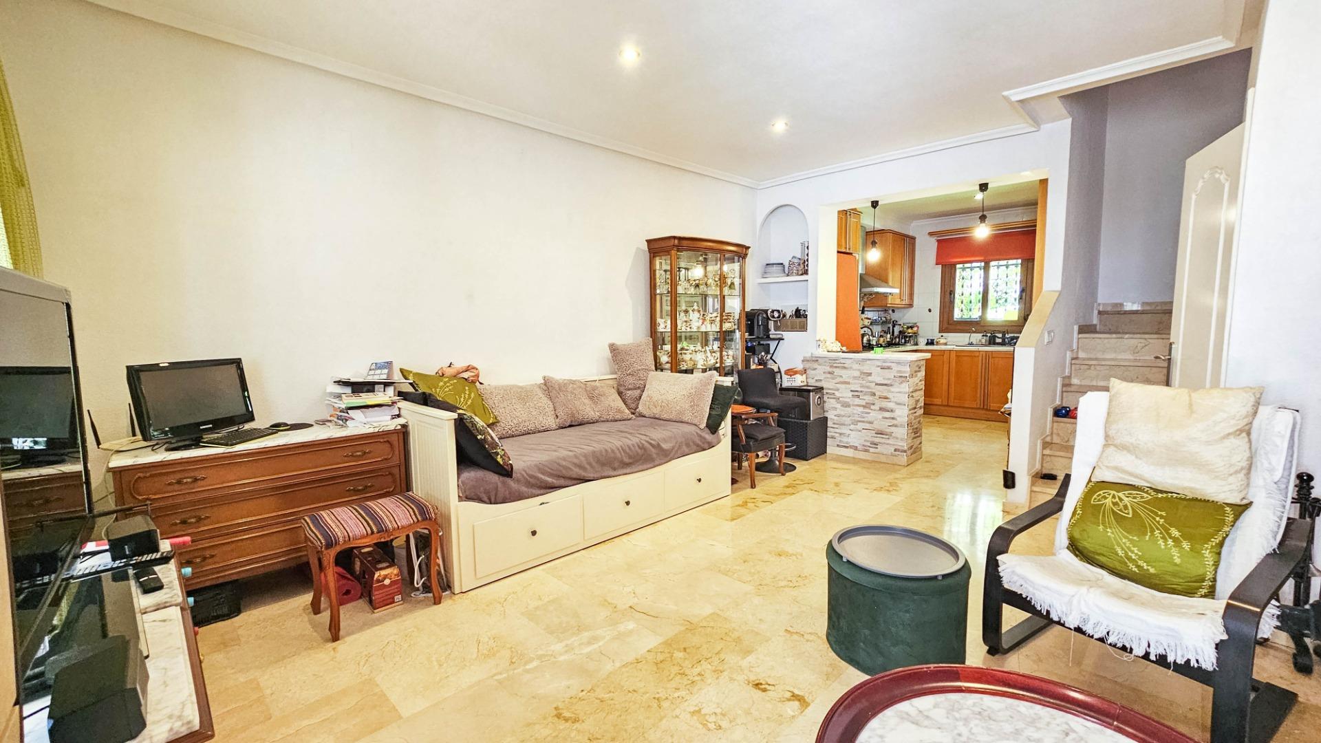 Open-plan kitchen with breakfast bar and fitted units in townhouse, PAU 8, Orihuela Costa