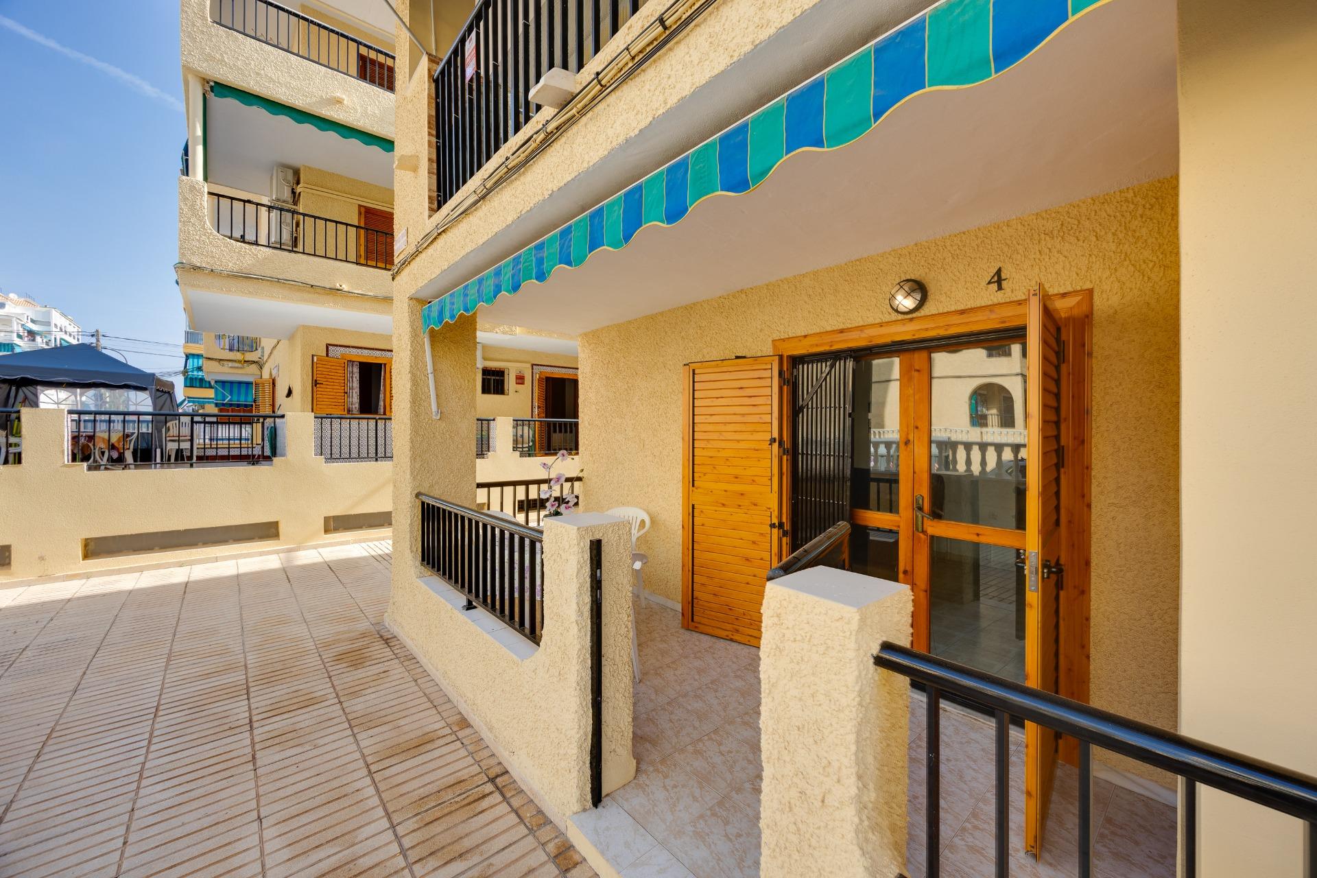 Living and dining area with integrated open-plan kitchen in 1-bedroom apartment, La Mata, Torrevieja