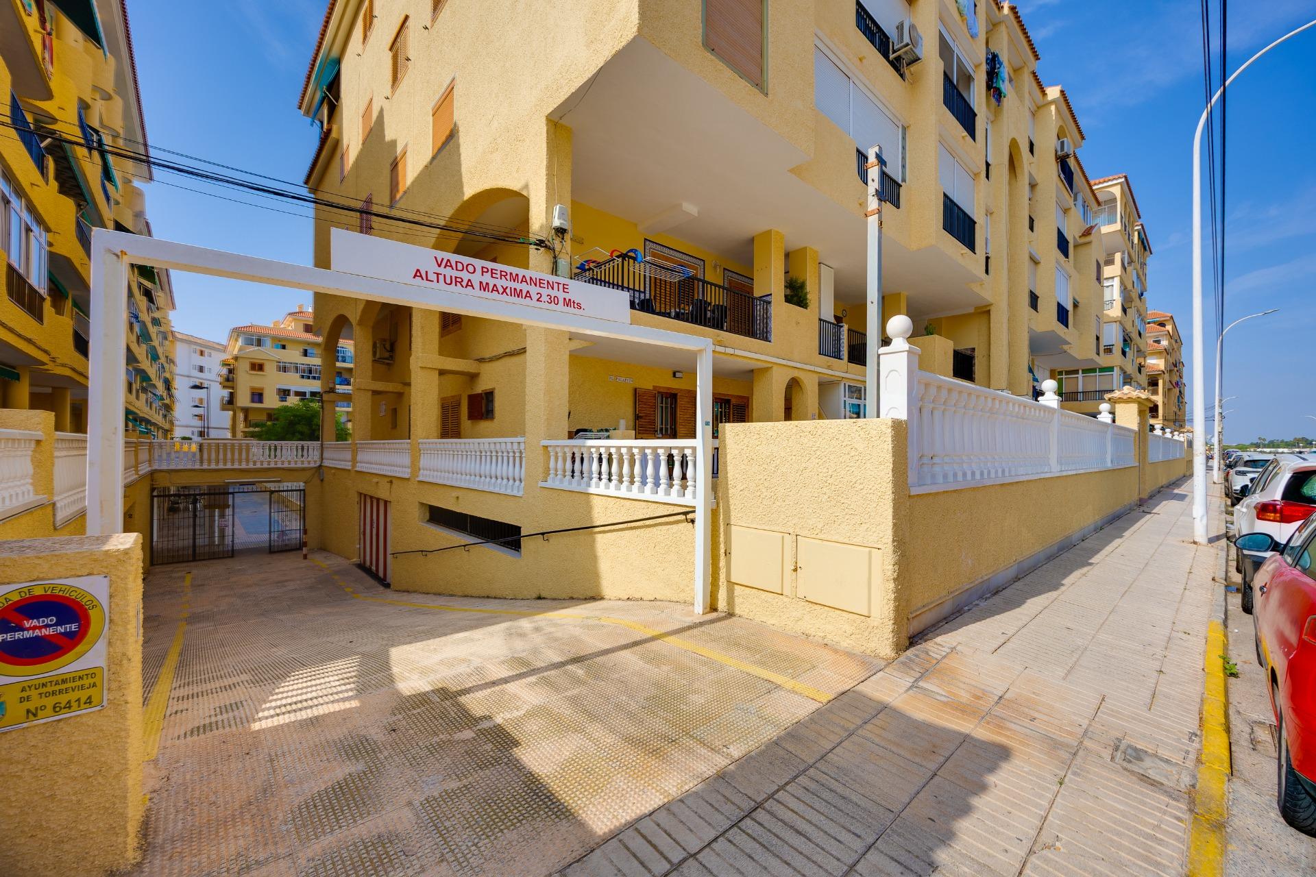 Communal pool viewed from poolside, gated complex, La Mata, Torrevieja