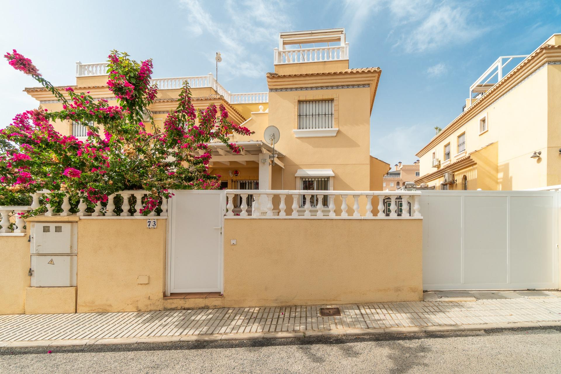 View of communal landscaped grounds from private garden, Los Dolses