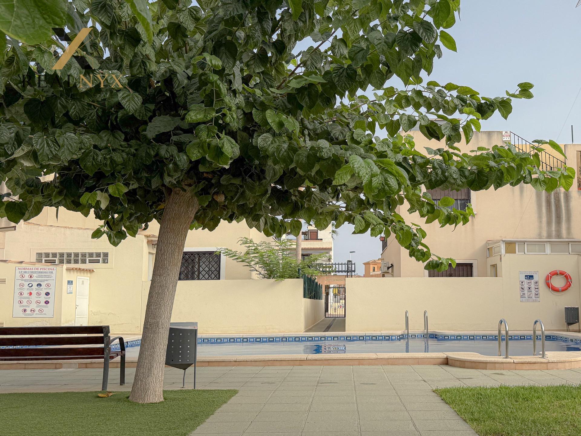 Pool area with surrounding paving and landscaping, Aguas Nuevas, Torrevieja