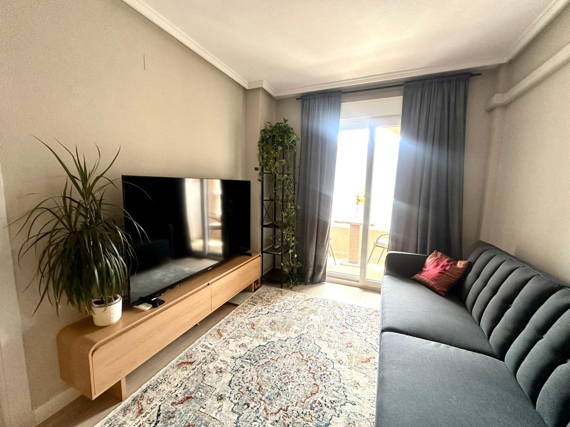 Living and dining area with new flooring in 1-bedroom apartment, Playa del Cura, Torrevieja
