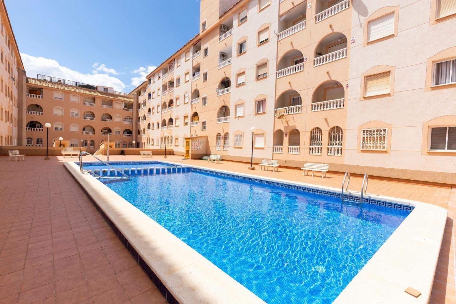 Building facade and entrance gate, Playa del Cura, Torrevieja