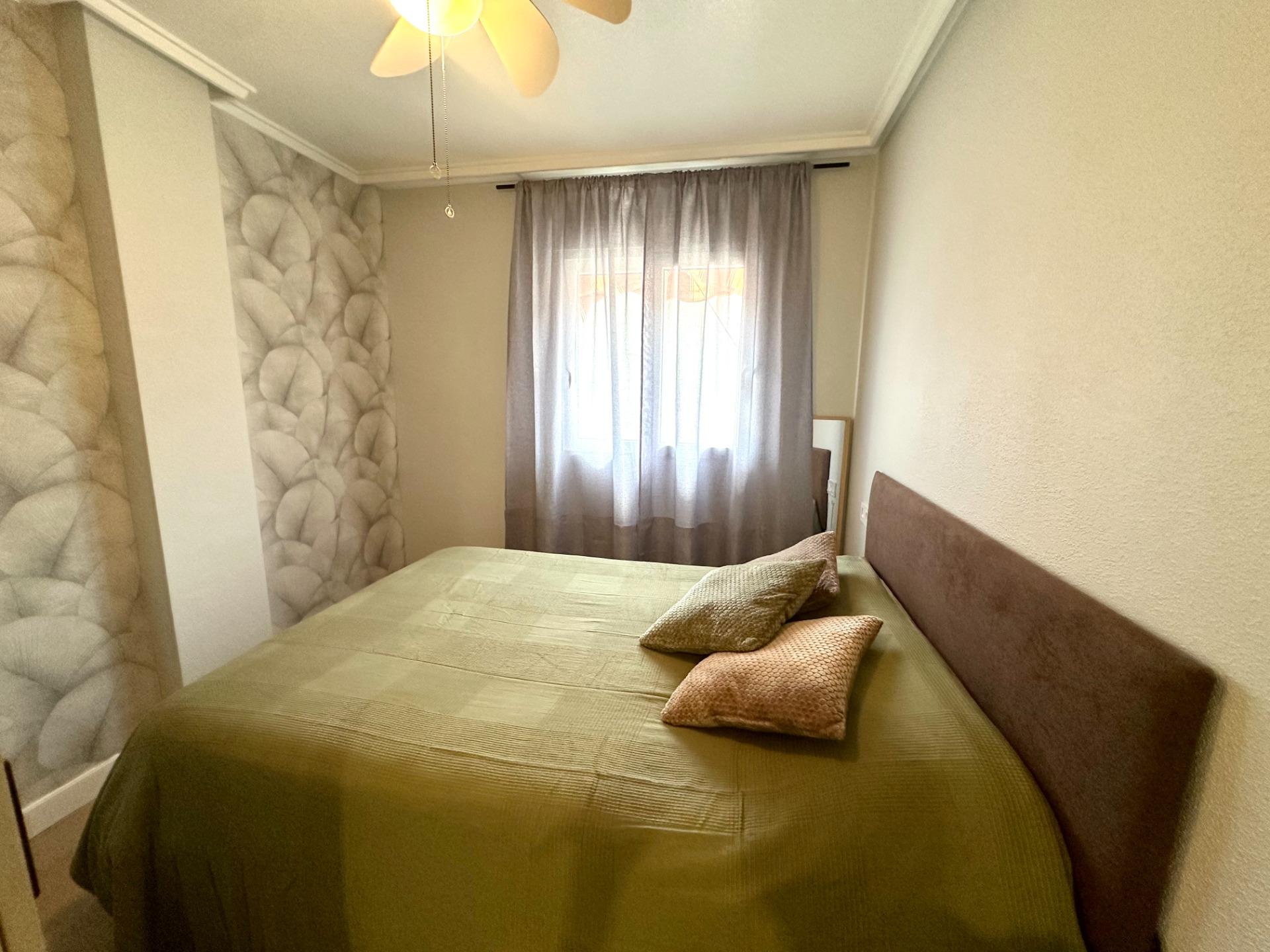 Bedroom interior showing south-facing window, 1-bedroom apartment, Playa del Cura