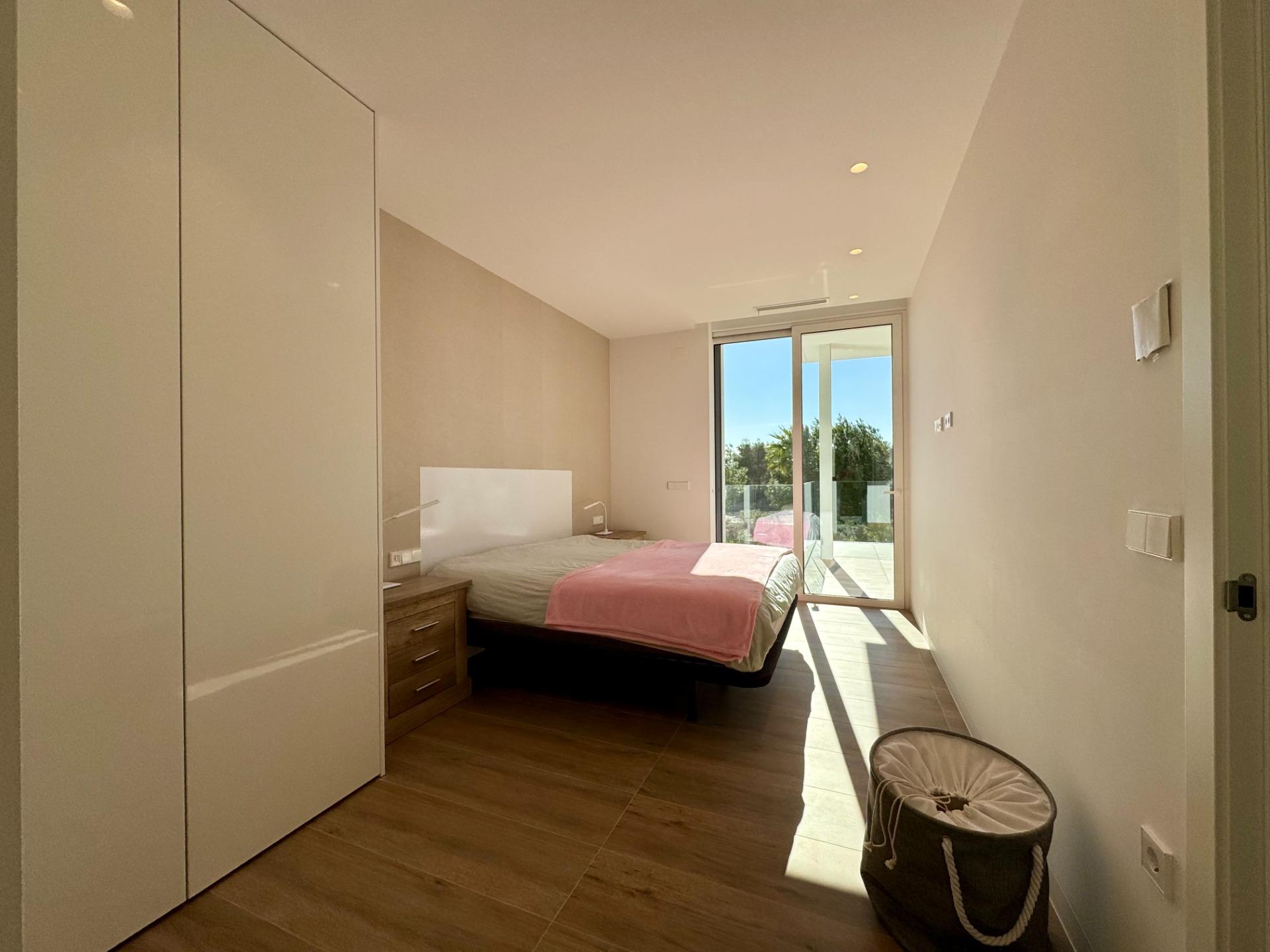 South-facing terrace with lounge and dining furniture, corner apartment in Las Colinas Golf