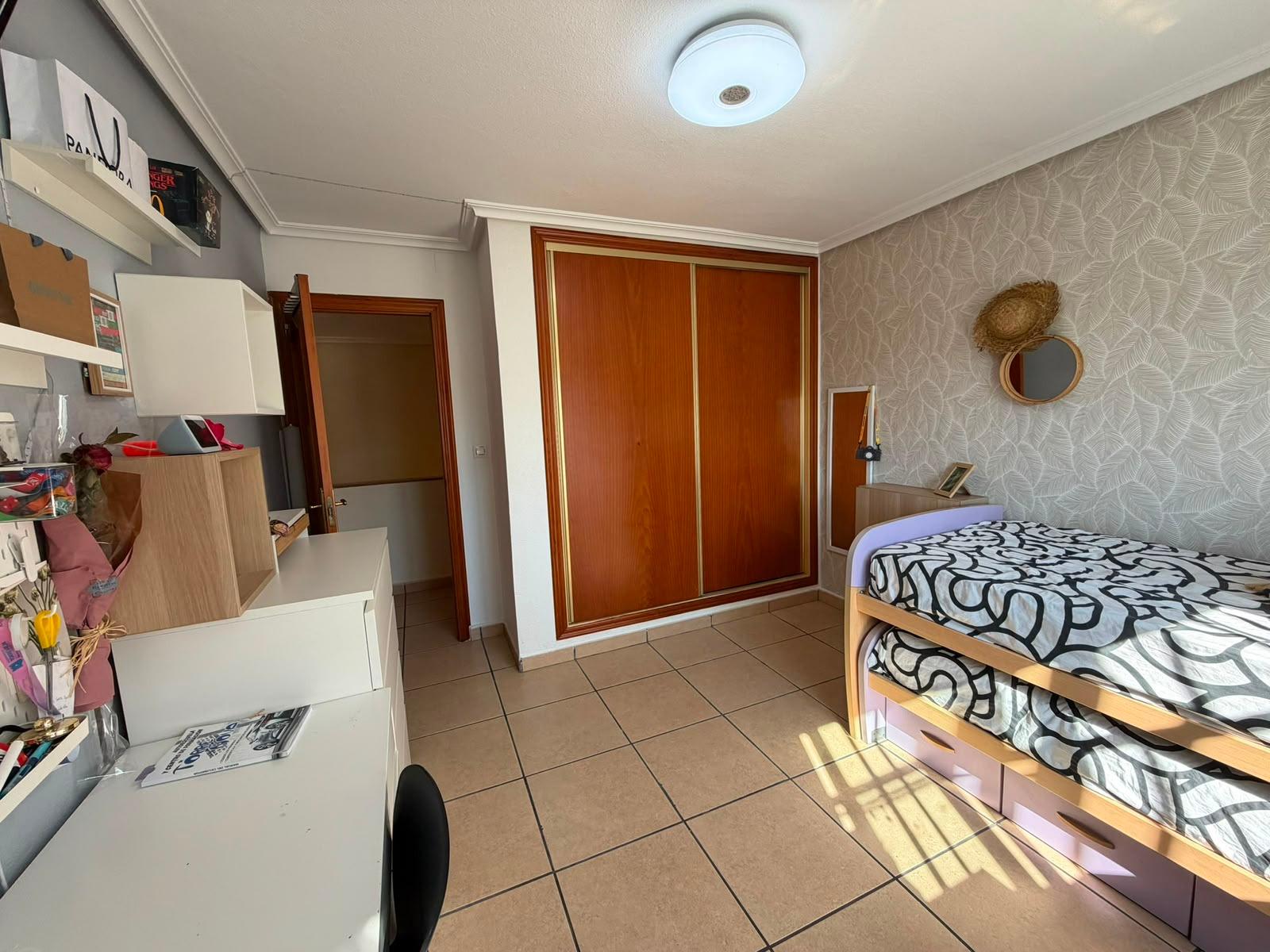 Semi-basement office with desk, chair and wall shelving, Torrevieja