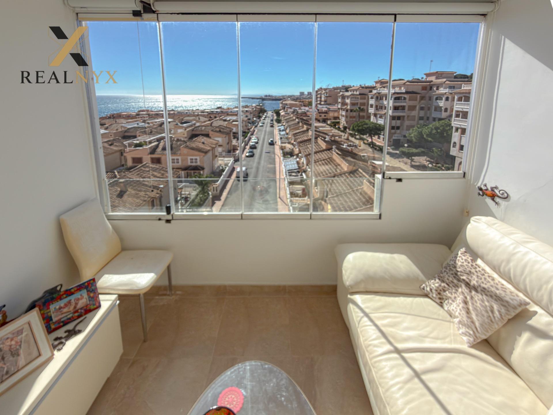 Living area with air conditioning unit in 2-bedroom penthouse, Cabo Cervera, Torrevieja