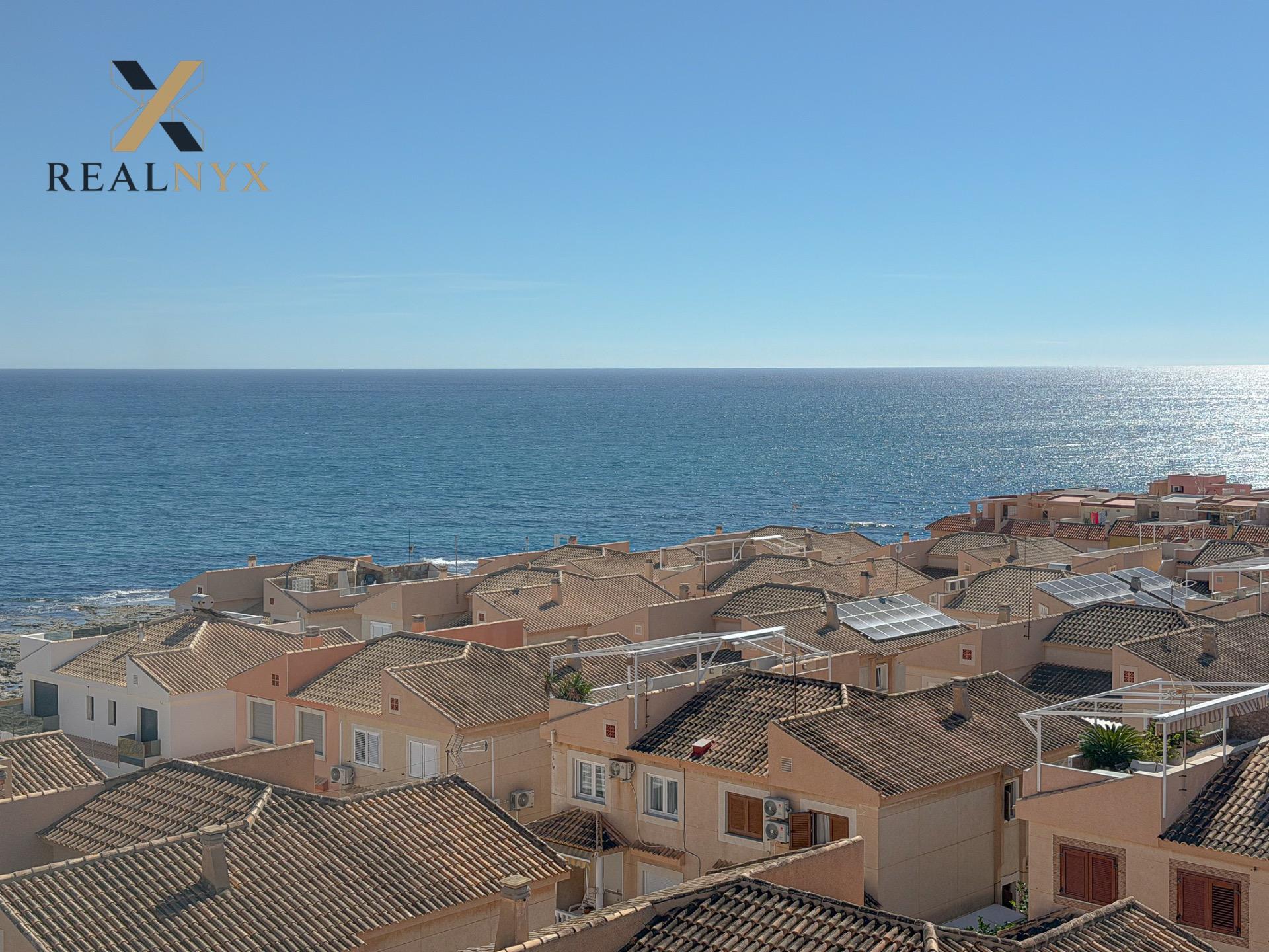 Window and south-facing outlook from living room, penthouse in Cabo Cervera