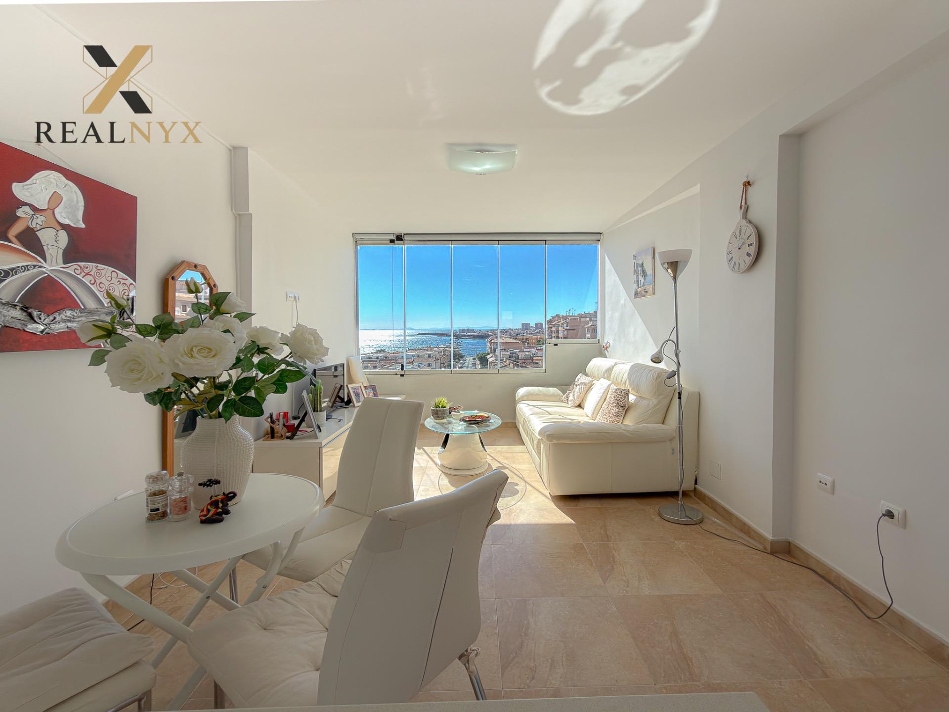 Living room with south-facing natural light in 2-bedroom penthouse, Cabo Cervera