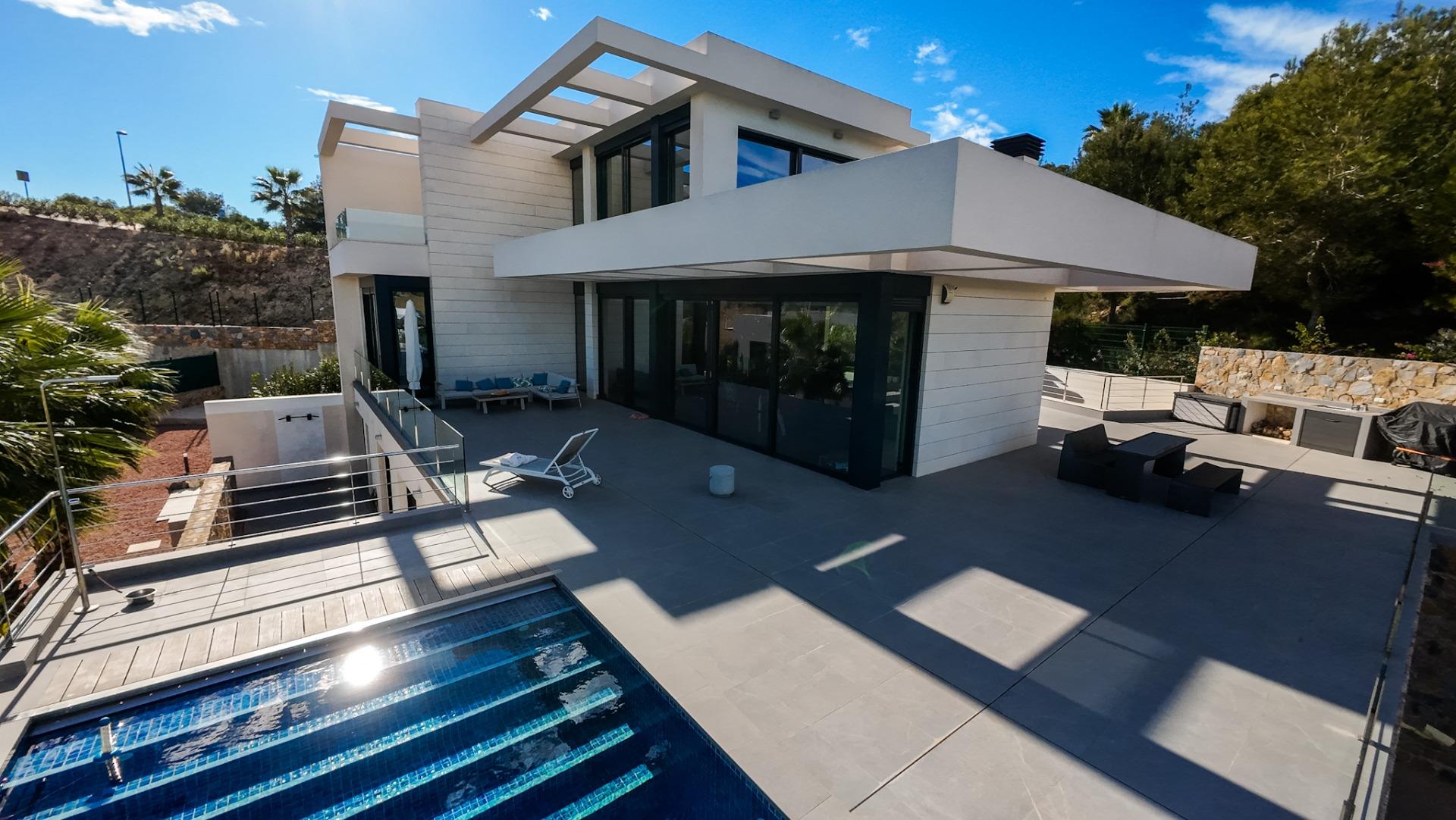 Open-plan living and dining area with large glazed doors, 6-bedroom villa, Las Colinas Golf