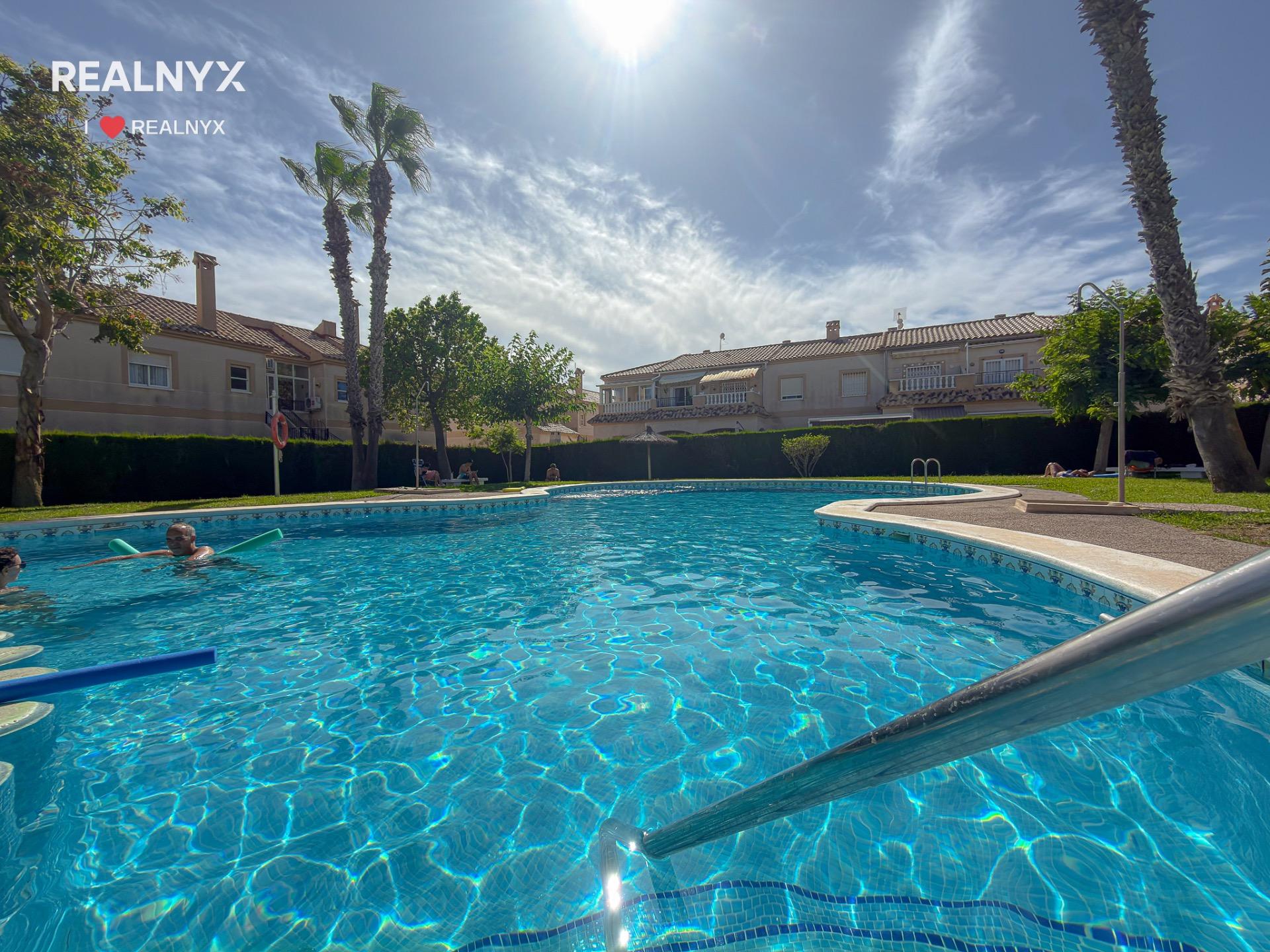 Pool area with surrounding garden, gated complex, Torreblanca, Torrevieja
