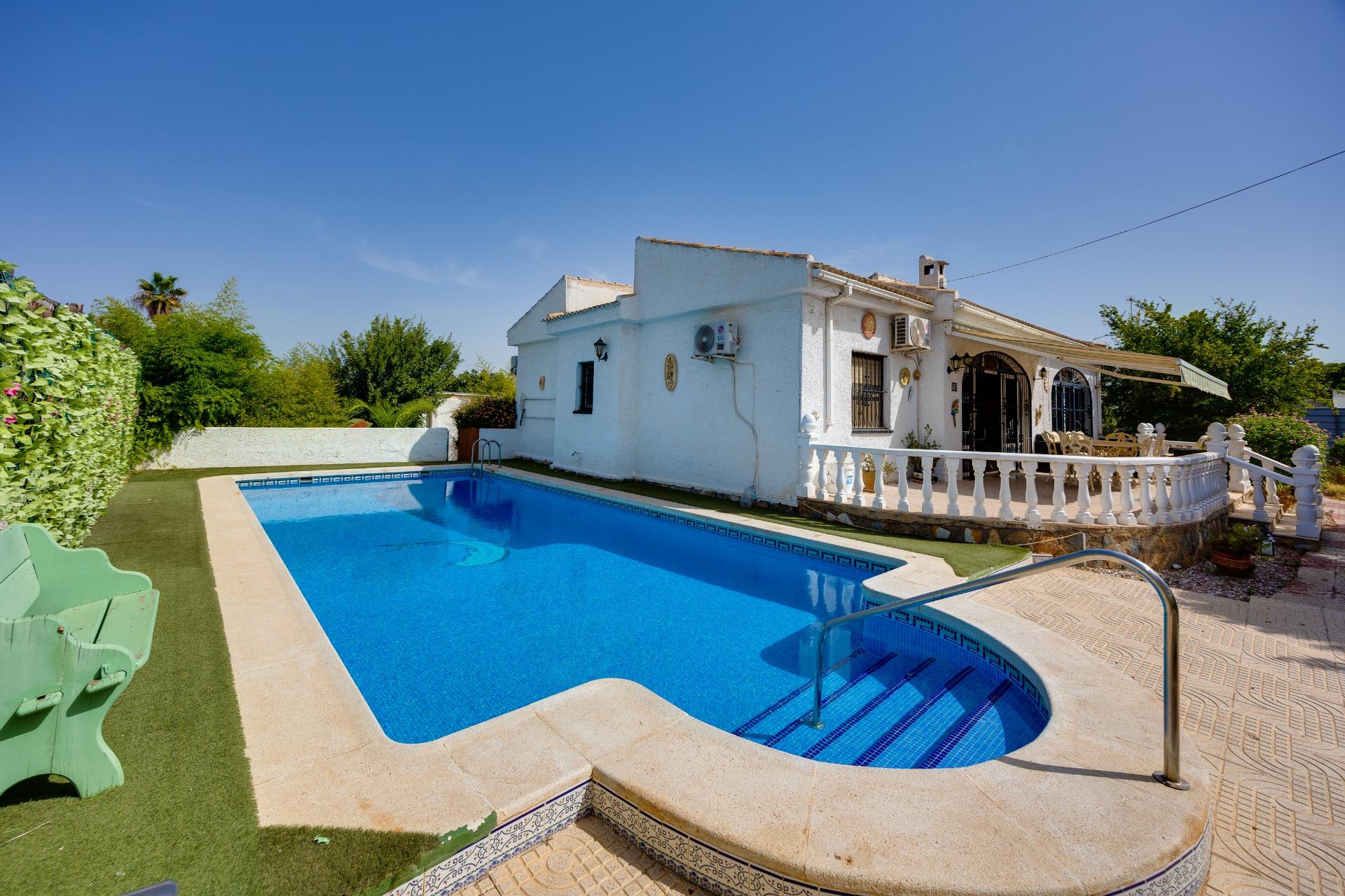 Private pool and tiled patio area at 4-bedroom villa in La Siesta, Torrevieja