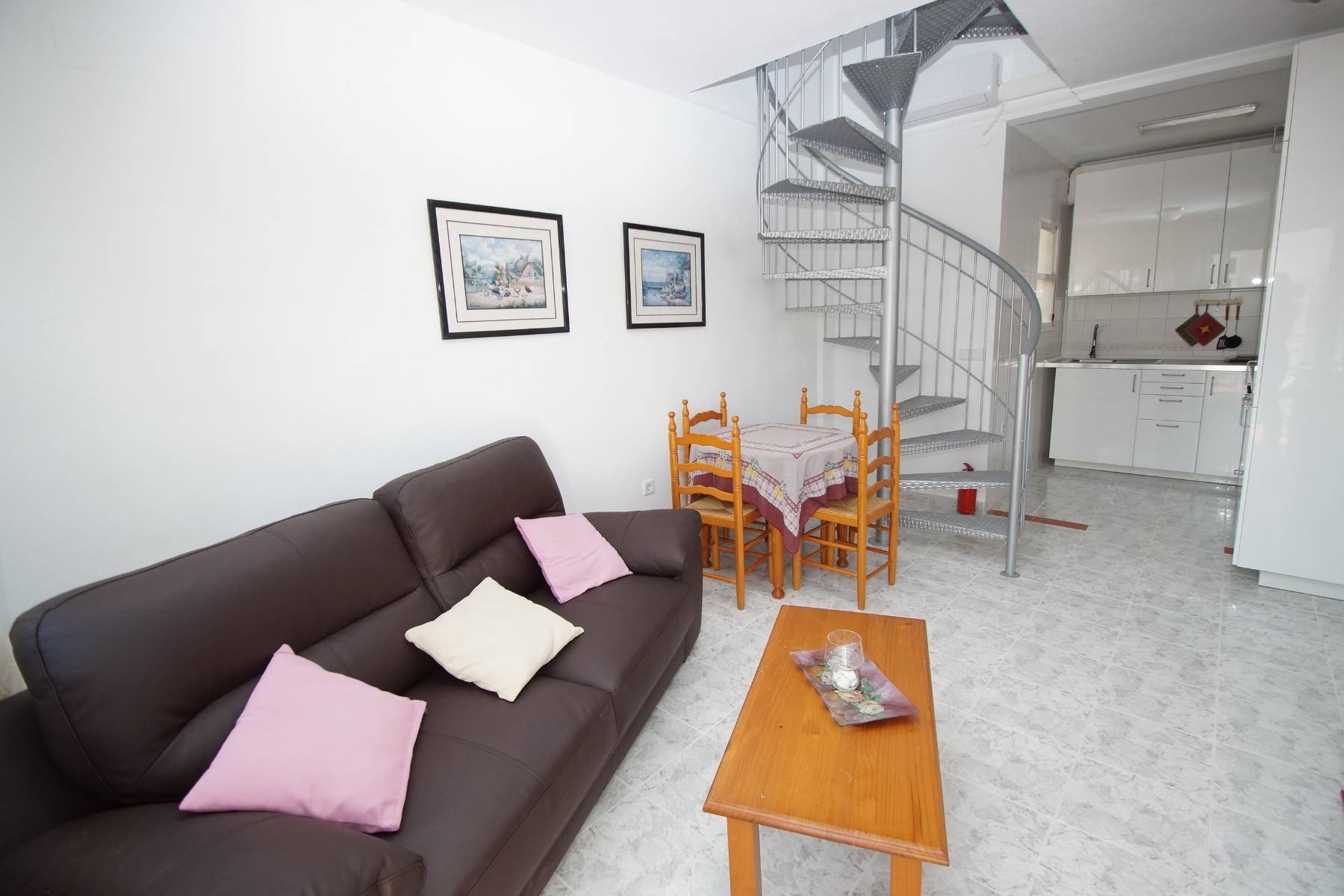 Living room with wall-mounted air conditioning unit in 2-bedroom bungalow, Playa Flamenca