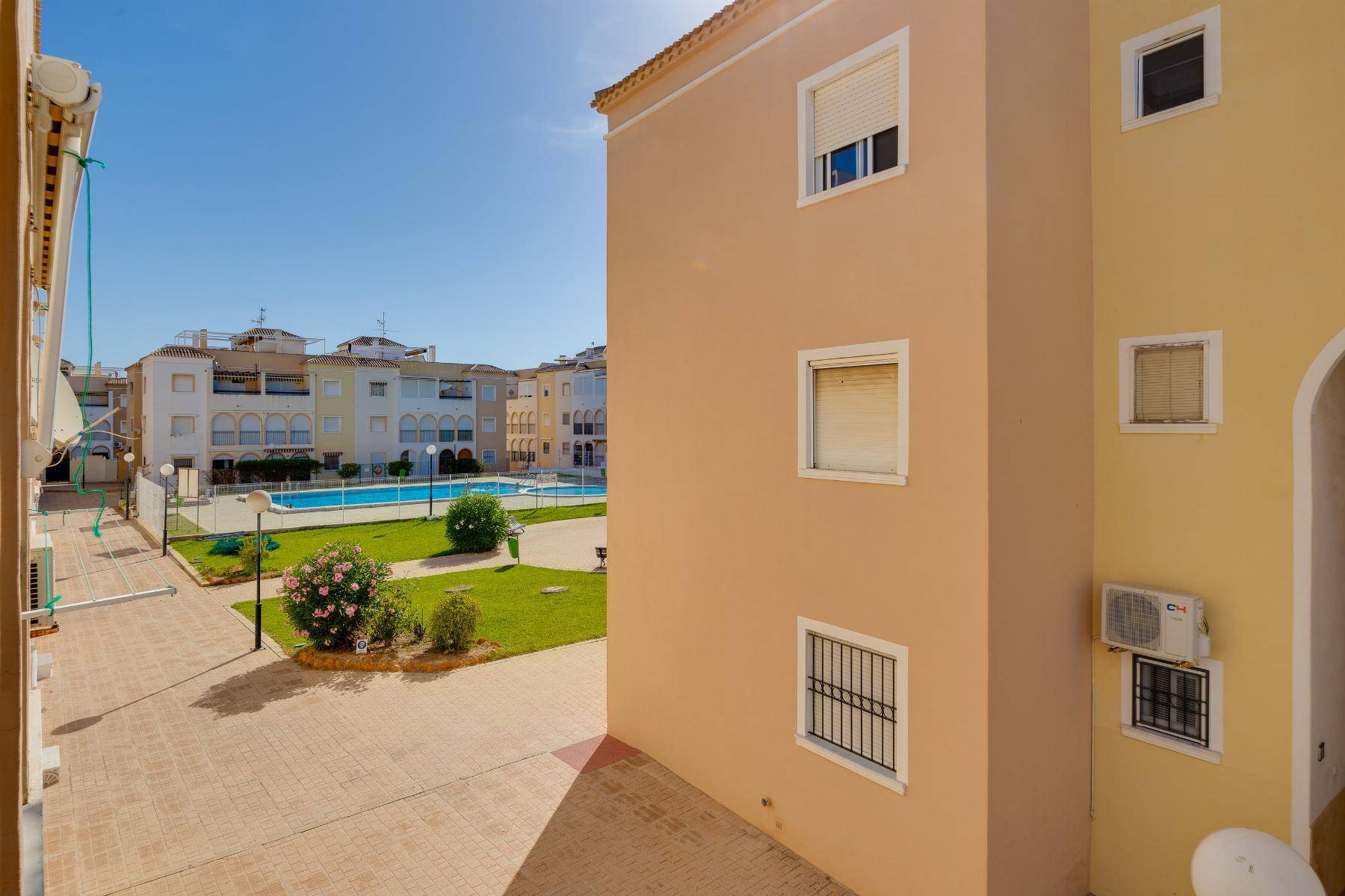 Communal pool area in bungalow complex, El Acequión, Torrevieja