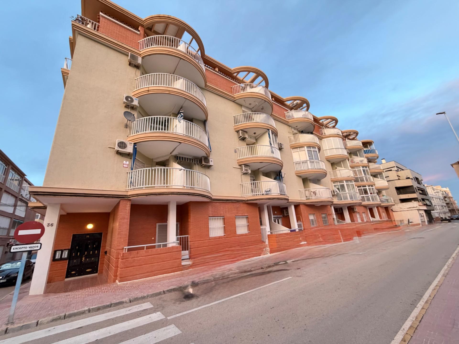 Street-level view outside apartment building in La Mata Pueblo, Torrevieja