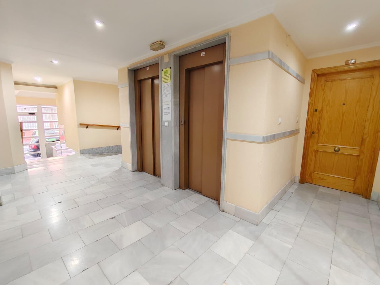 Entrance and lift lobby in apartment building, Playa del Cura
