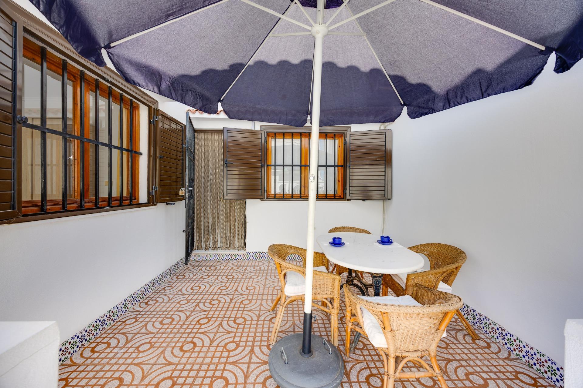 Communal pool area serving villa complex in Calas Blanca, Torrevieja