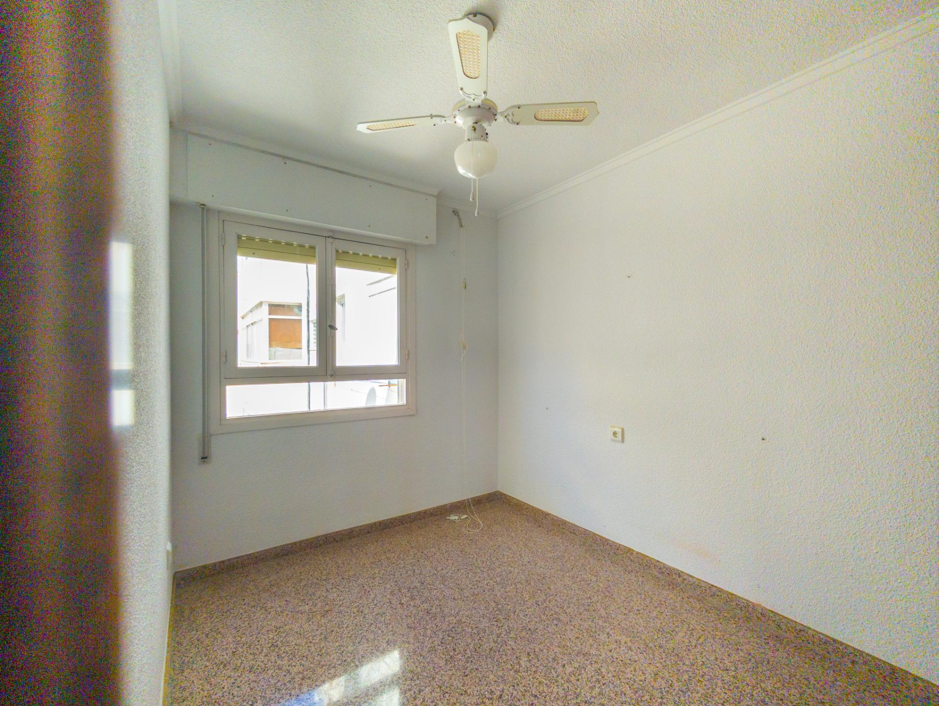 Natural light in living room of 8th-floor apartment, La Mata Pueblo