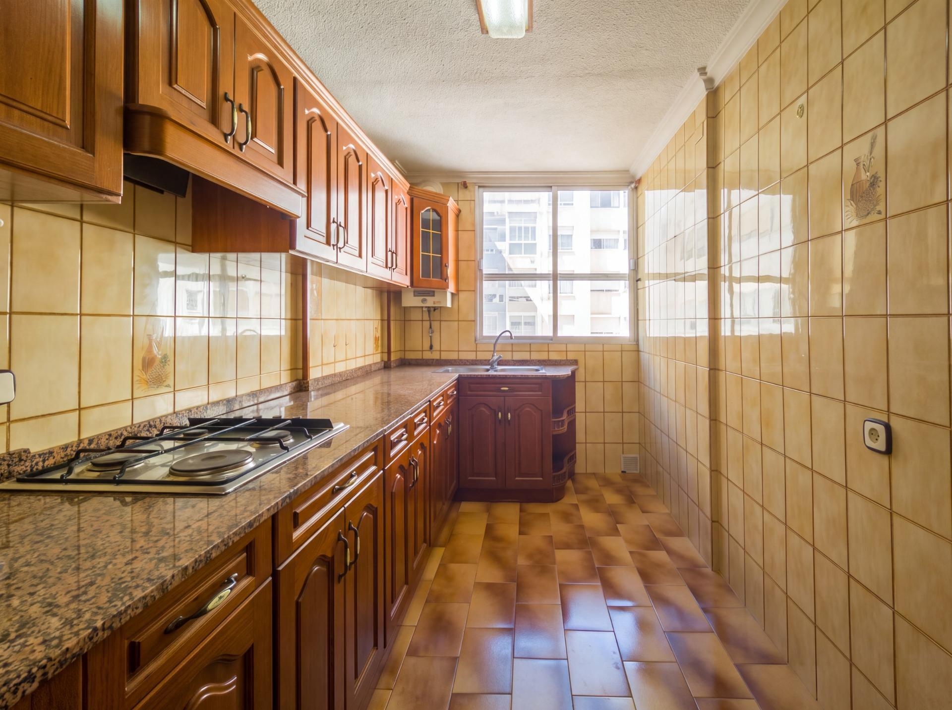 Laundry area adjacent to kitchen in 3-bedroom apartment, La Mata Pueblo