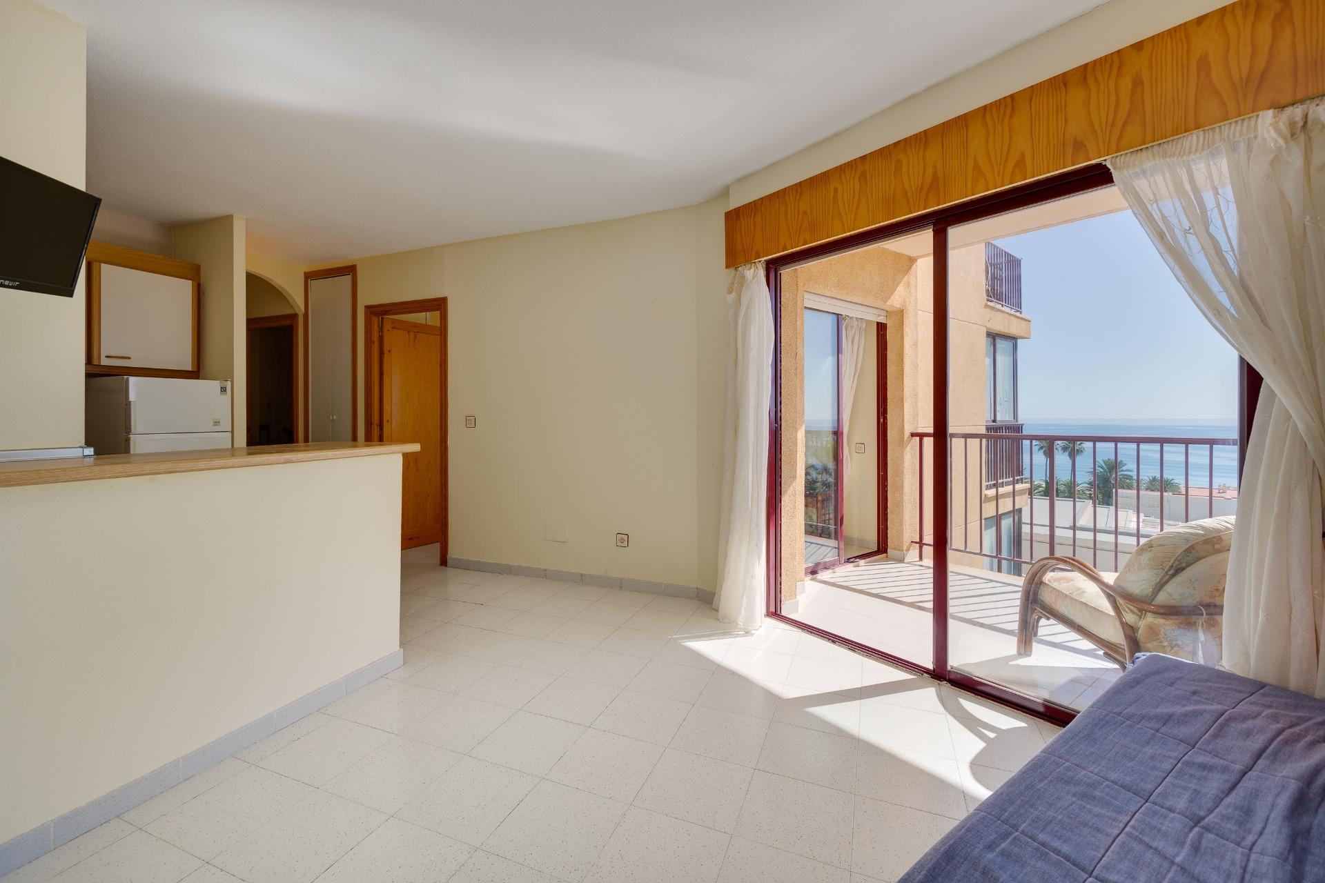 Master bedroom with built-in wardrobes and terrace access, La Mata apartment