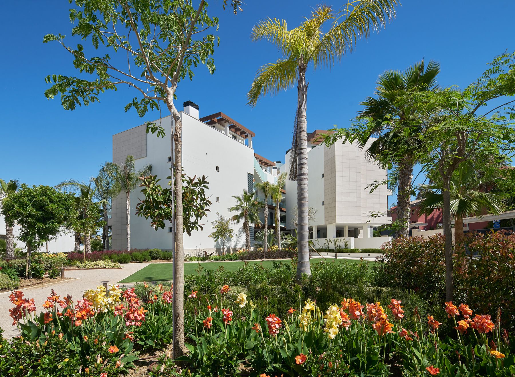 Landscaped grounds and building facade of new-build development, Guadalobón, Estepona